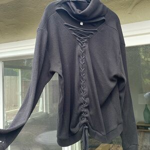 Peace Love World medium turtleneck. Ties down the back